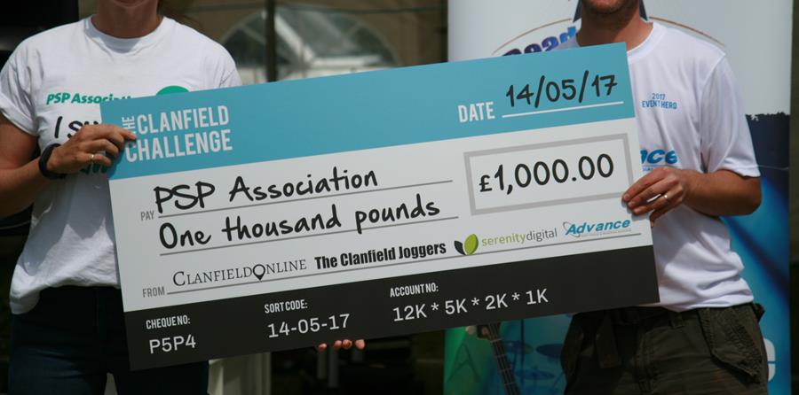 Image-of-one-thousand-pound-cheque-being-presented-to-PSPA